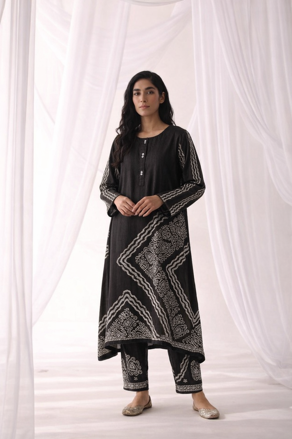 Black Digital Battik Print Silk Kurta with matching trousers in the same fabric to create a coordinated look.